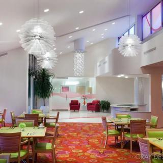 A modern restaurant interior with vibrant colors and stylish lighting.