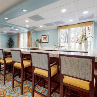 A stylish bar area with comfortable seating and elegant decor.