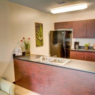 A modern kitchen with sleek cabinetry, stainless steel appliances, and a clean countertop design.