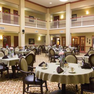 An elegant indoor dining area with neatly arranged tables and chairs.