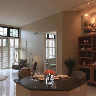 A modern open-concept living room and dining area with elegant furniture and decor.