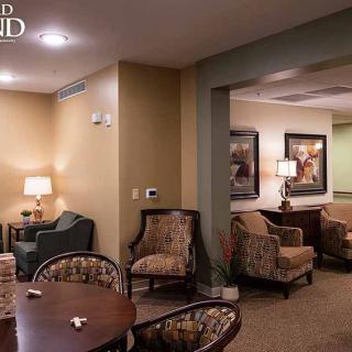 A cozy living room with comfortable seating and warm lighting.