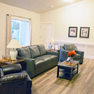 A cozy living room with modern furniture and soft lighting.