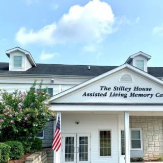 The front view of an assisted living memory care center building.
