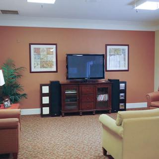 A cozy living room setup with a television and comfortable seating.