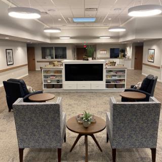 A cozy lounge area featuring modern furniture and a welcoming design.