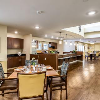 A modern dining area with stylish furniture and warm lighting.