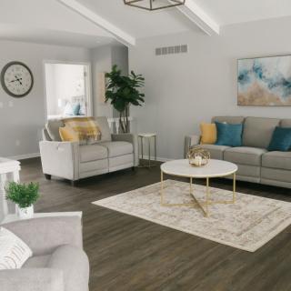 A stylish living room with modern furniture and cozy decor.