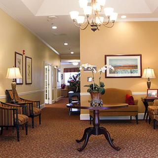 A well-decorated lobby area with elegant furniture and warm lighting.