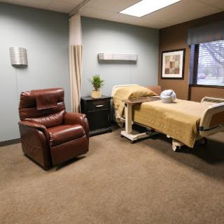 A comfortable and well-equipped patient room in a healthcare facility.