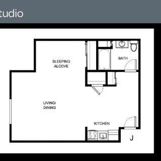 A floor plan of a studio apartment with a sleeping alcove, living/dining area, kitchen, and bathroom.