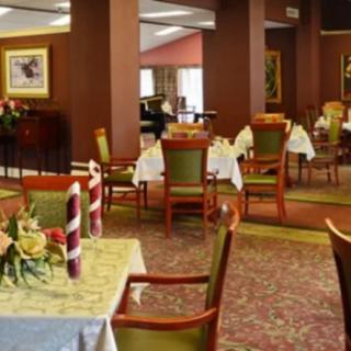 Elegant dining area with neatly arranged tables and chairs.