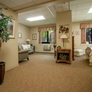 A cozy living room with comfortable seating and warm lighting.