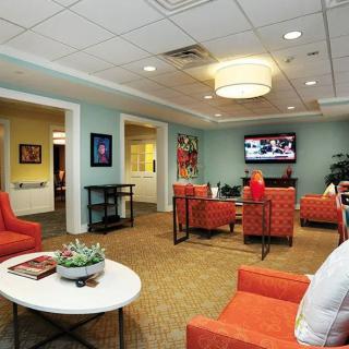 A modern living room with comfortable seating and a television.