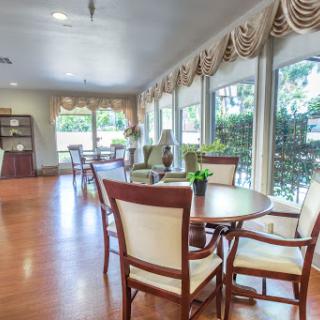 A bright and inviting lounge area featuring comfortable seating and ample natural light.