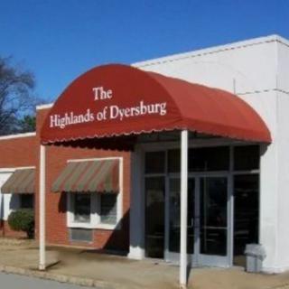 Entrance with red awning labeled 'The Highlands of Dyersburg'.