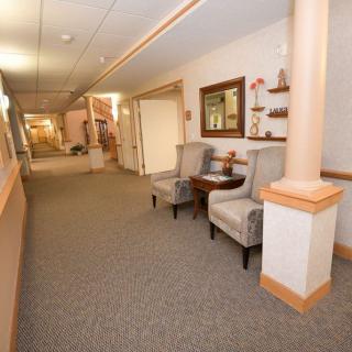 A cozy hallway with chairs and decorative elements.
