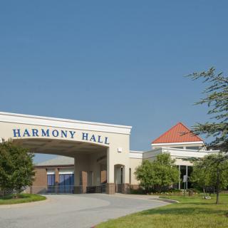 Entrance to Harmony Hall with clear blue skies.