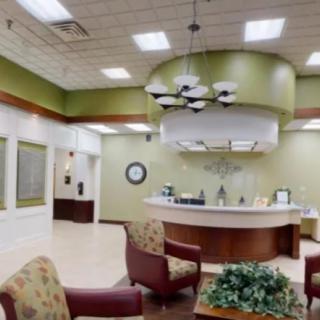 A modern reception area with comfortable seating and a sleek design.