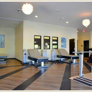 A modern fitness gym with sleek exercise equipment and contemporary interior design.