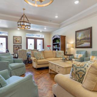 A cozy living room featuring comfortable seating and elegant decor.