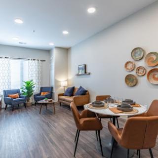 A bright and inviting living space featuring modern furniture and stylish decor.