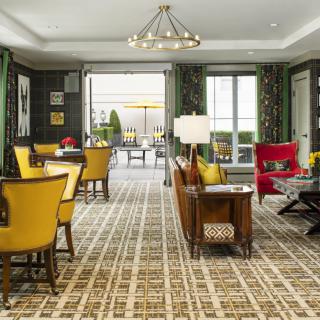 A luxurious living room interior with modern furniture and decorative elements.