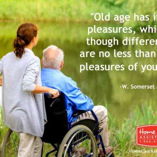 A caregiver and an elderly person in a wheelchair enjoy a serene outdoor scene, accompanied by a quote from W. Somerset Maugham about the pleasures of old age.