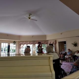 A cozy indoor space where people gather and interact.