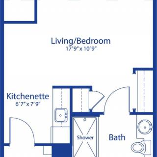 A floor plan of a studio apartment featuring a living/bedroom area, kitchenette, and bathroom.