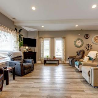 A modern and cozy living room with ample seating and natural light.
