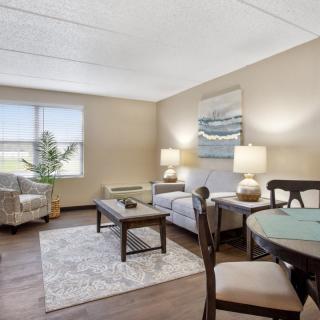 A cozy living room with comfortable seating and soft lighting.