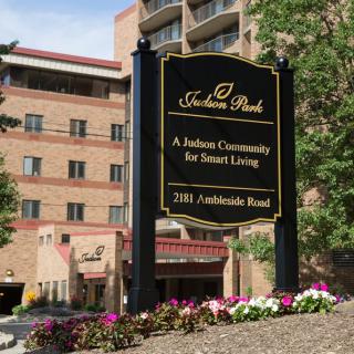 A retirement community building with a sign indicating smart living at Felicia Park.