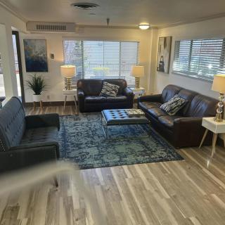 A cozy living room with sofas, a coffee table, and stylish decor.