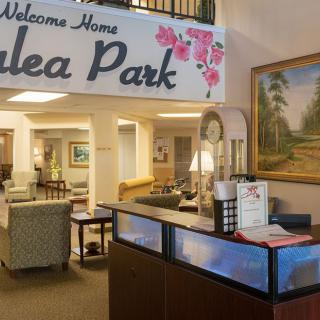 A welcoming reception area at Azalea Park with cozy seating and decorative elements.