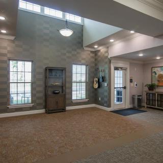 A modern lobby interior with large windows and stylish decor.