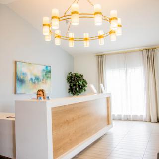 A modern reception area featuring elegant lighting and a welcoming atmosphere.