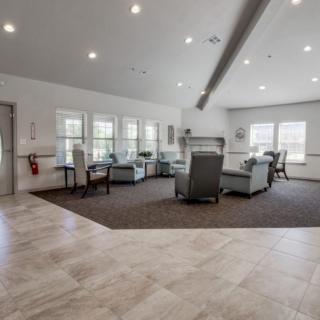A spacious living room with comfortable seating and ample natural light.