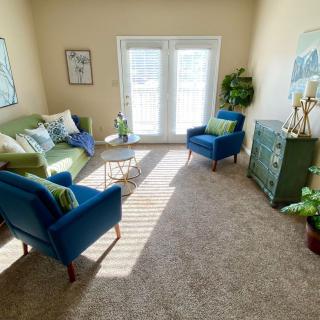 A cozy living room with stylish furniture and natural light.