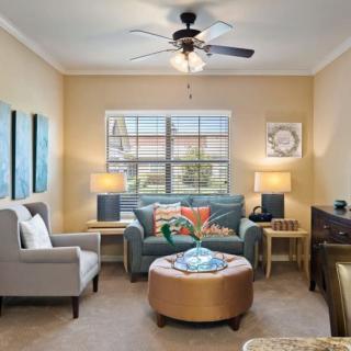 A cozy living room with stylish furniture and decor.