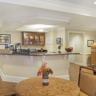 A modern kitchen with a counter and cozy seating area.