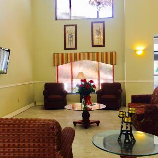 A spacious lobby area with comfortable seating and elegant decor.