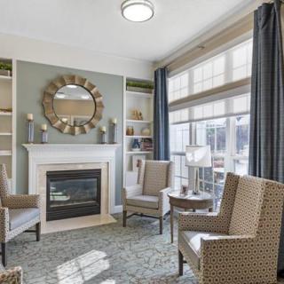 A cozy living room with elegant decor and ample natural light.