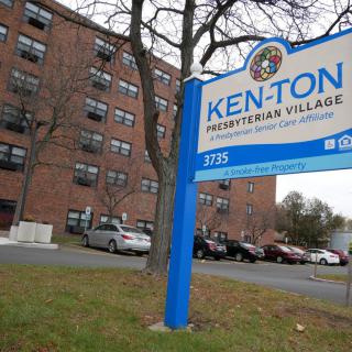 Exterior view of the Ken-Ton Presbyterian Village with its entrance sign and parking area.
