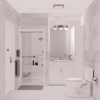 A modern bathroom with a glass shower, vanity, and sleek design.