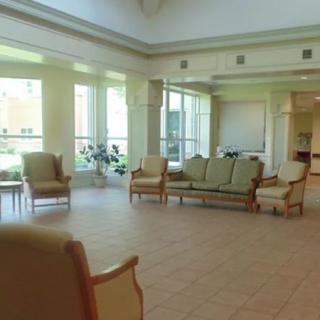 A spacious lobby with comfortable seating and natural light.
