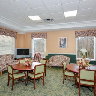 A cozy lounge area featuring comfortable seating and dining arrangements.