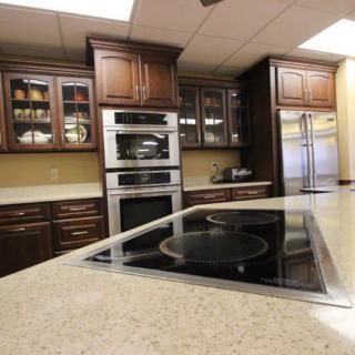 A modern kitchen interior with sleek cabinetry, built-in appliances, and a spacious countertop.