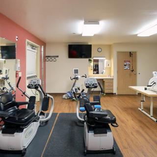 A fitness room equipped with stationary bikes and exercise equipment.