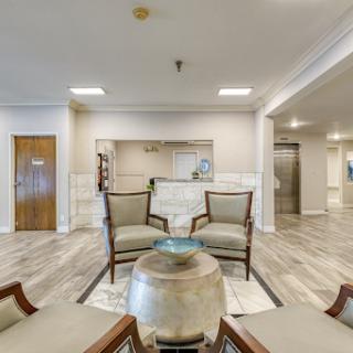 A modern lobby featuring comfortable seating and a welcoming reception area.